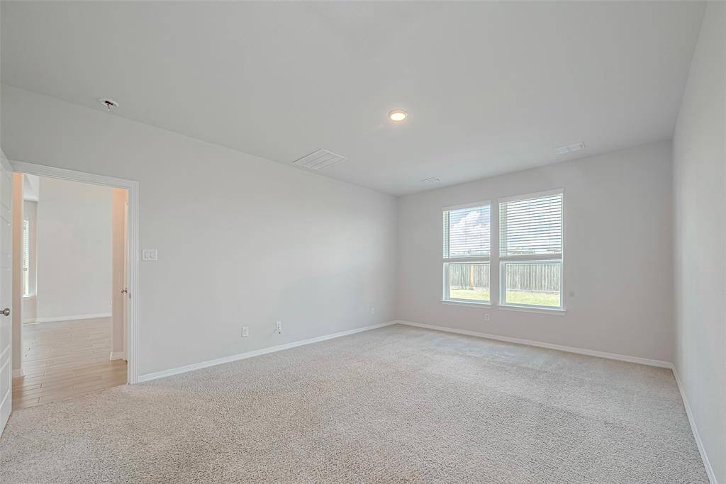 3rd bedroom upstairs with soft carpet and light colored paint sharing a bathroom with bedroom  # 4.