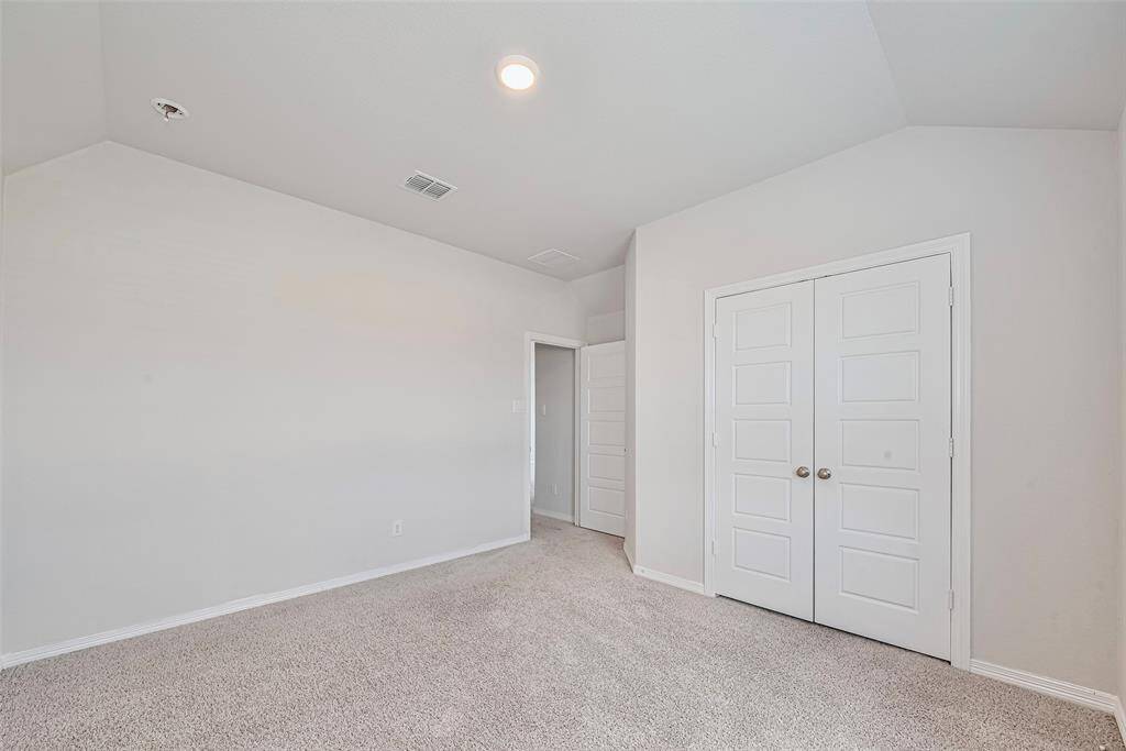 3rd bedroom upstairs with soft carpet and light colored paint sharing a bathroom with bedroom  # 4.