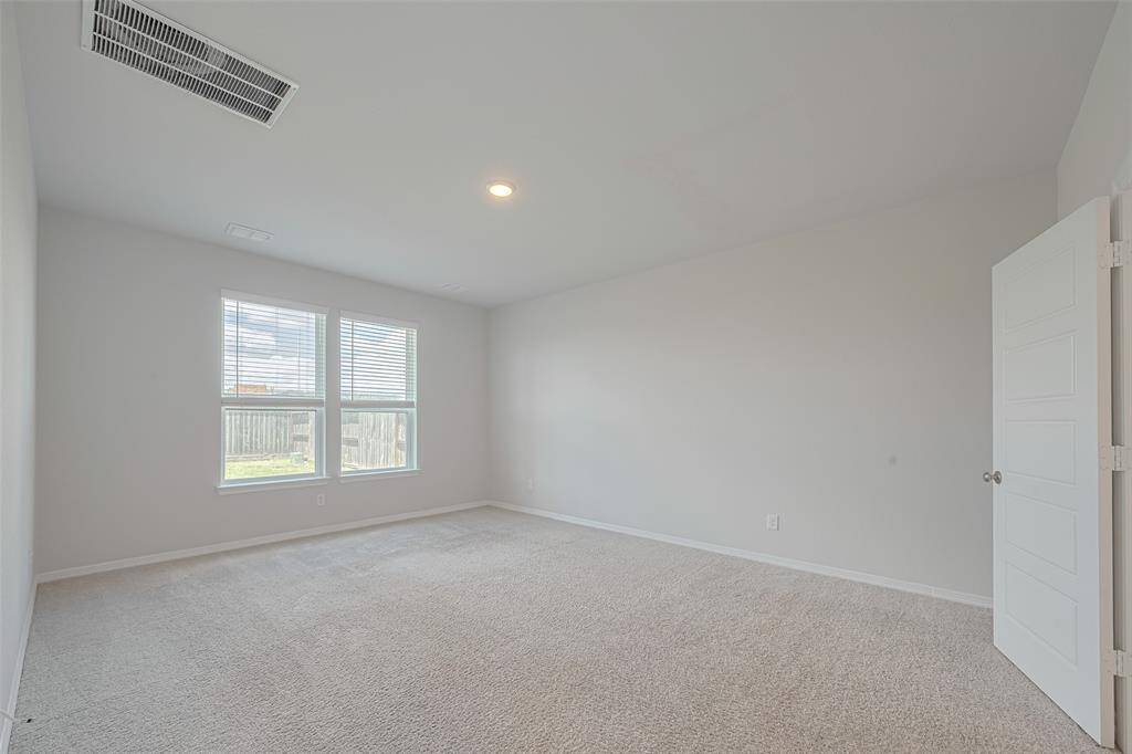 3rd bedroom upstairs with soft carpet and light colored paint sharing a bathroom with bedroom  # 4.