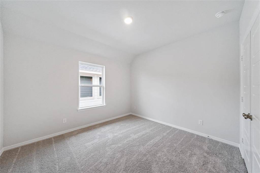 4th bedroom upstairs with soft carpet and light colored paint sharing a bathroom with bedroom  # 3.