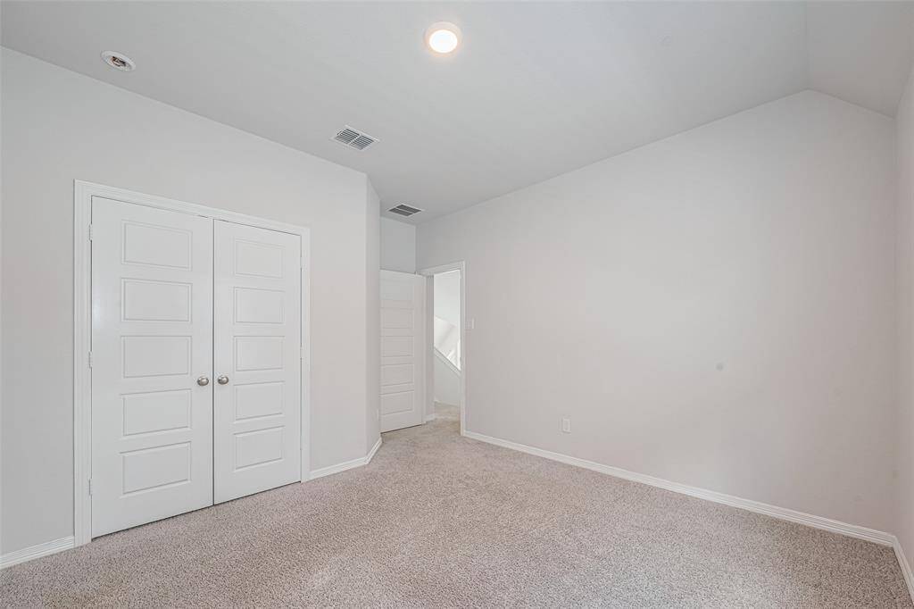 4th bedroom upstairs with soft carpet and light colored paint sharing a bathroom with bedroom  # 3.