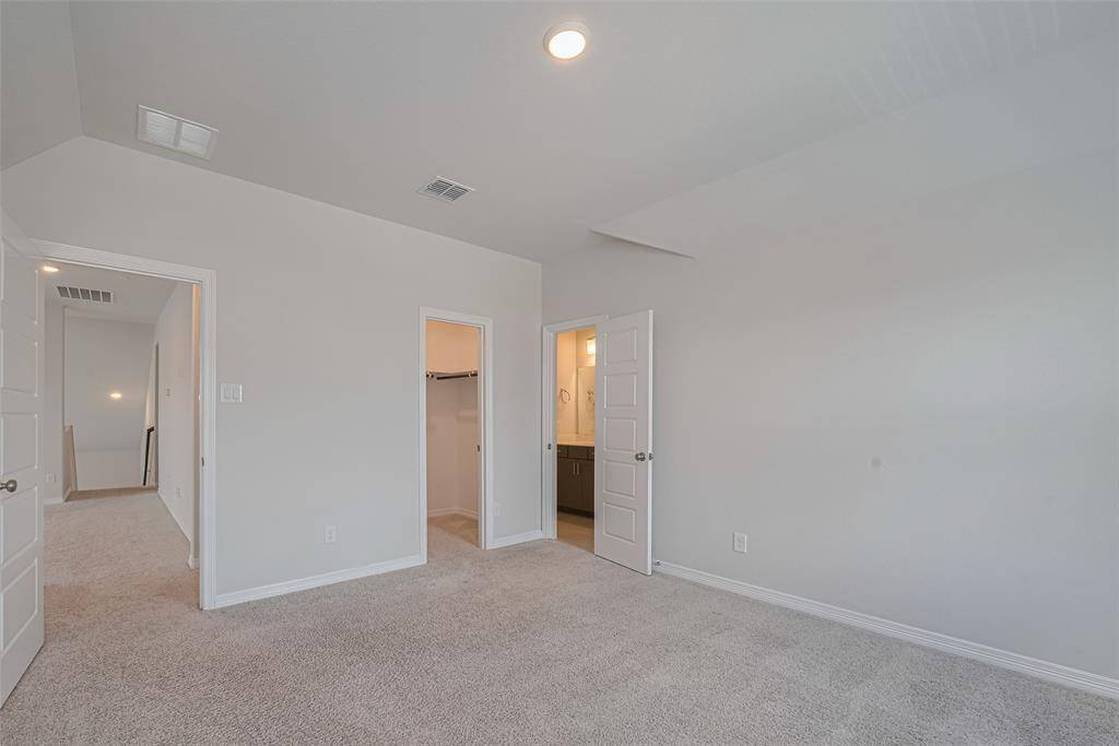 Spacious 5th bedroom upstairs with full bath.