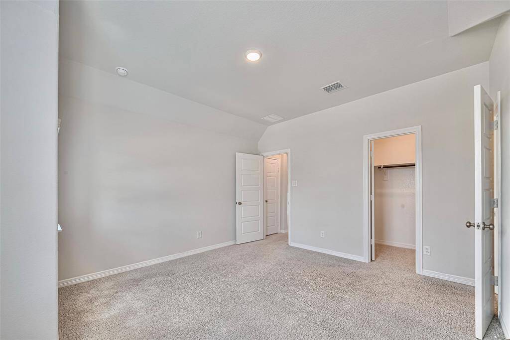 Spacious 5th bedroom upstairs with full bath.