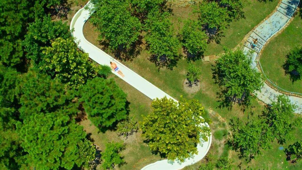 This aerial view showcases a huge winding water slide