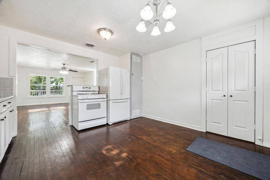 VIEW OF THE KITCHEN AND DEN.