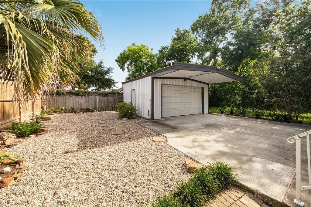 VIEW OF THE OVERSIZED GARAGE FROM THE BACK PATIO.