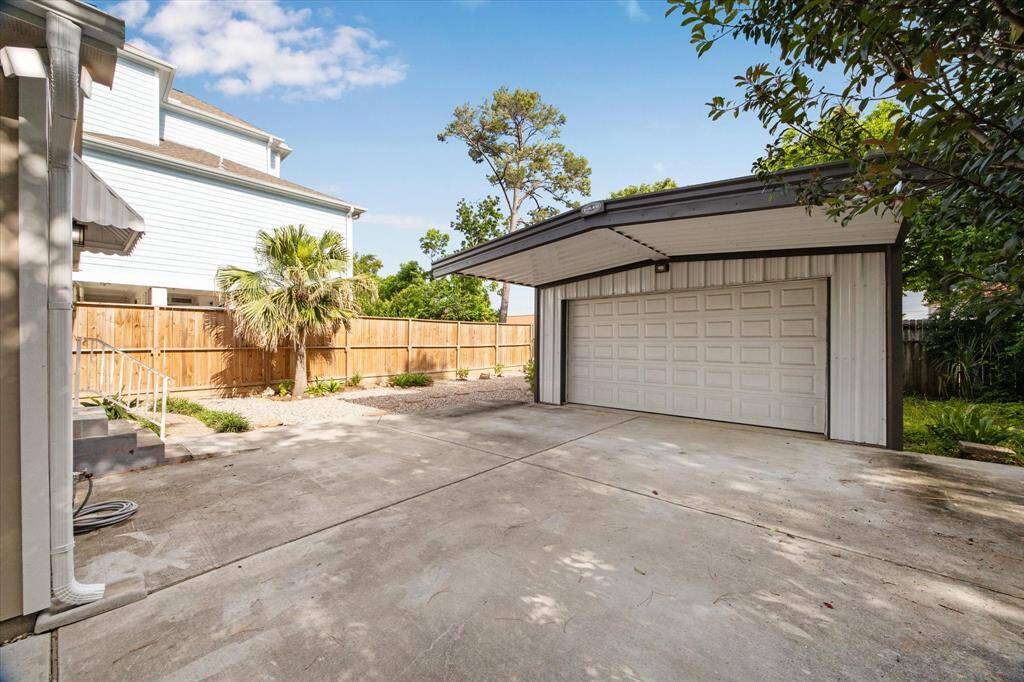 THE LONG DRIVEWAY, OVERHANG AND 2 CAR GARAGE OFFER PLENTY OF PARKING.