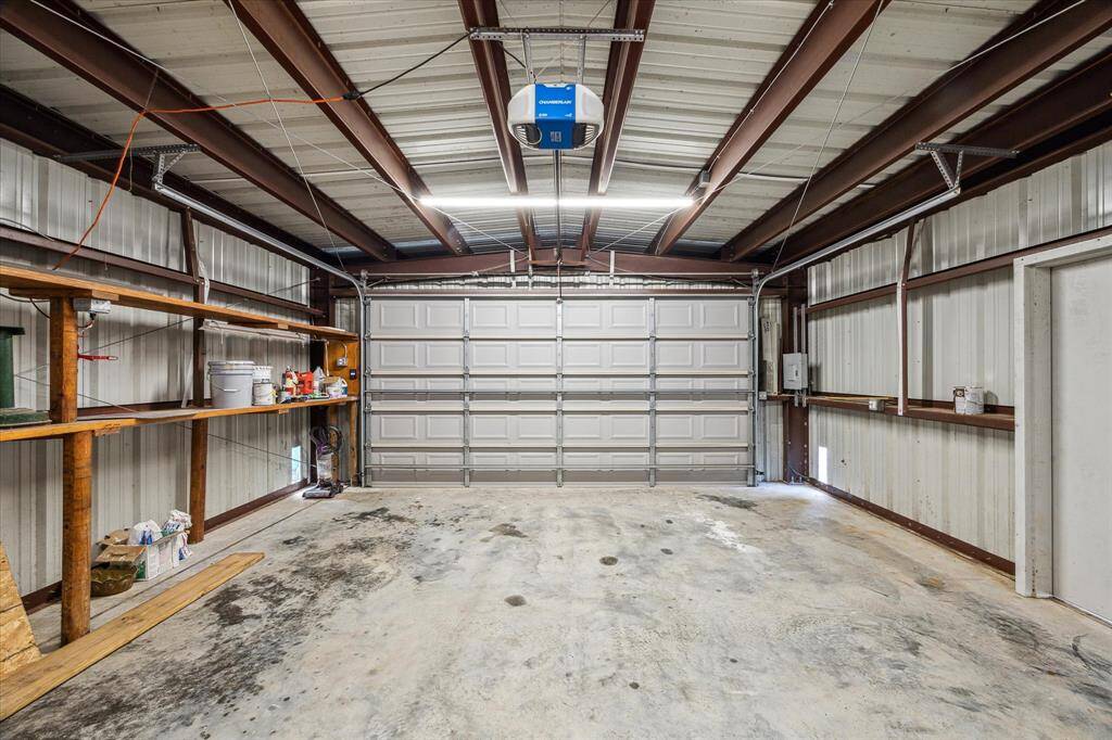 OVERSIZED 2 CAR GARAGE WITH GARAGE DOOR OPENER.