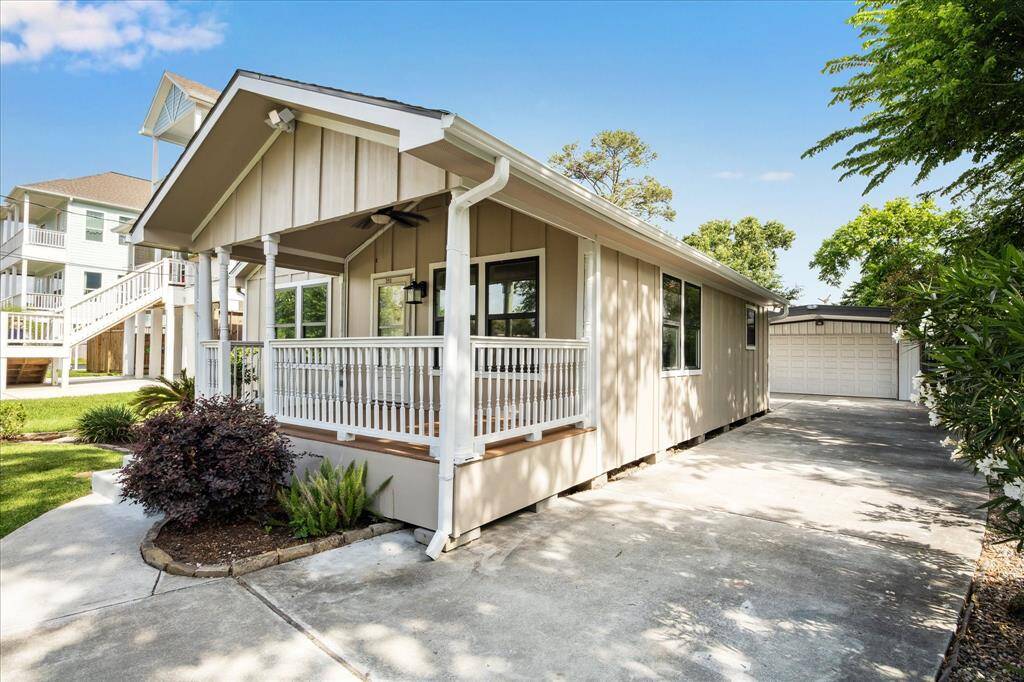YOU ALSO HAVE A LONG DRIVEWAY AND OVERSIZED 2 CAR GARAGE!