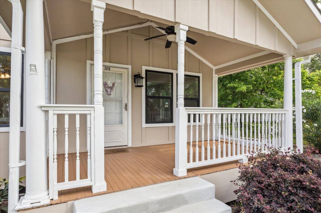 INVITING FRONT PORCH TO RELAX ON.