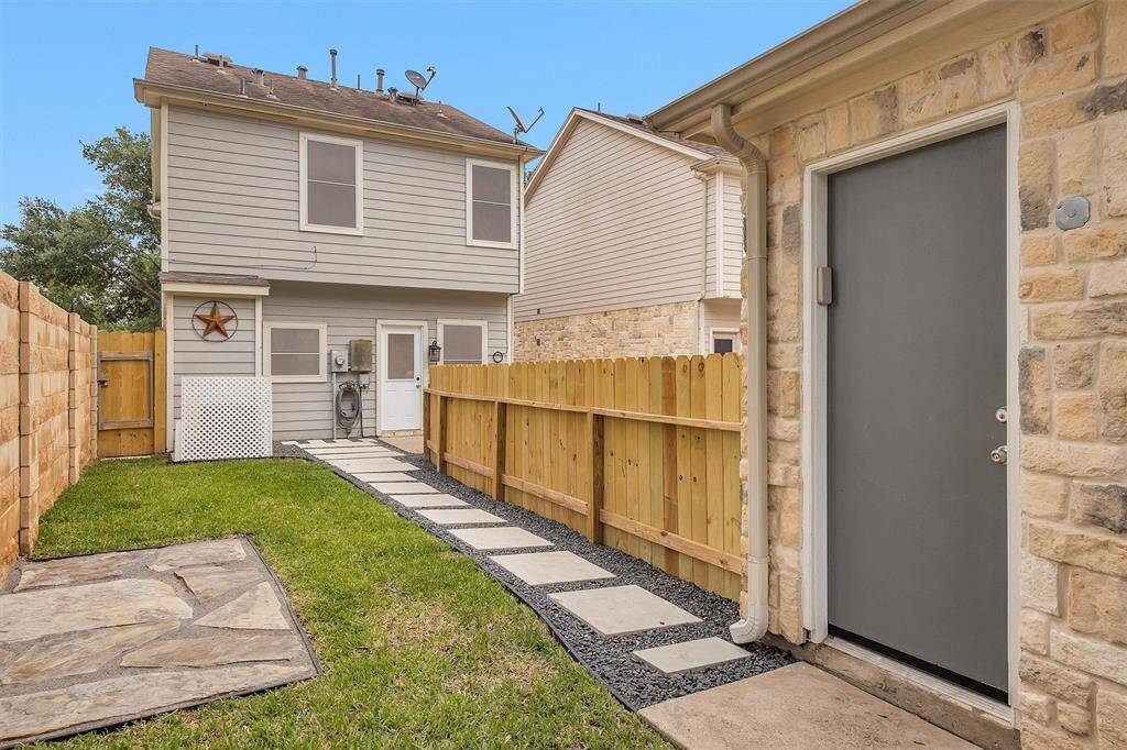 Easy to maintain lawn, additional space behind detached garage.