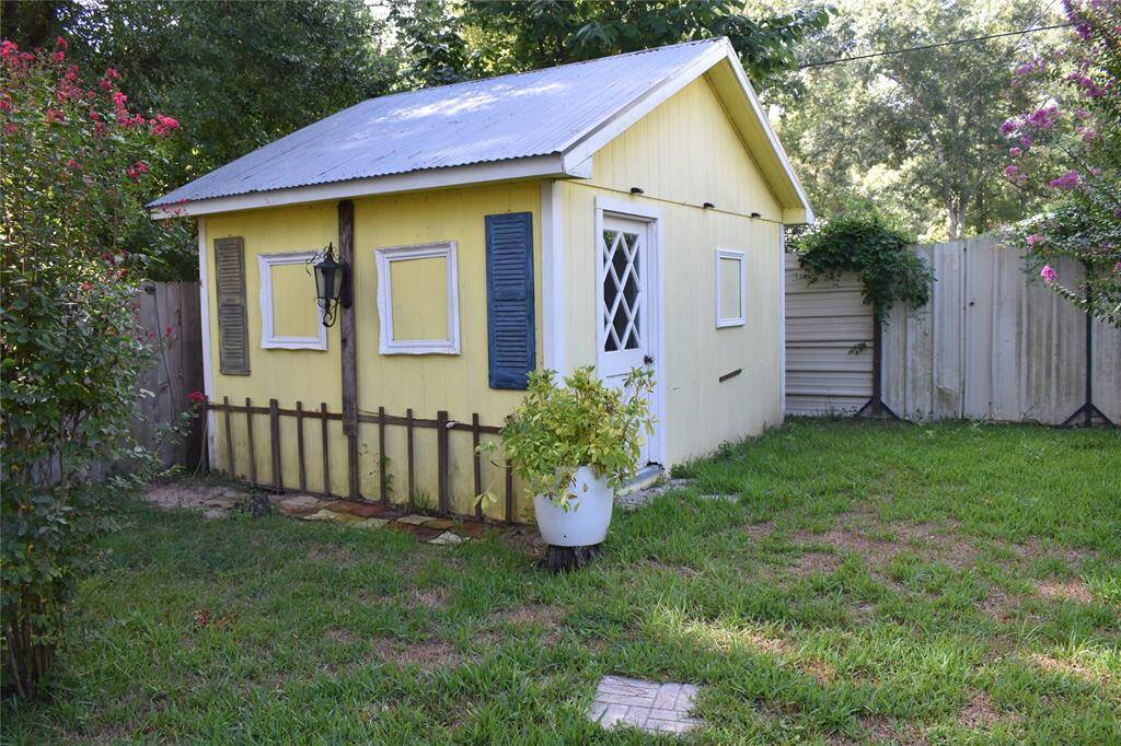 Large storage shed located in the back yard.