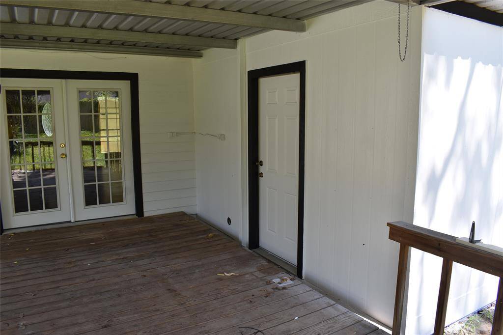 Another view of the back porch. The door to the right gives you access to the utility room.