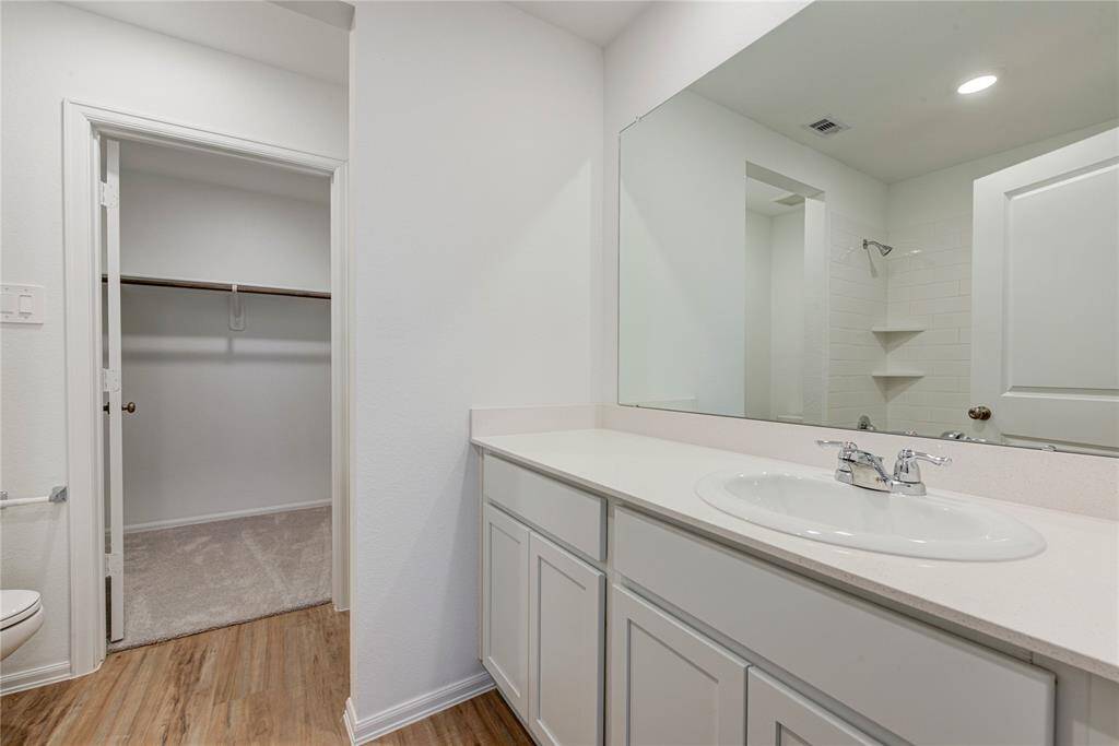 Three bedrooms are located upstairs