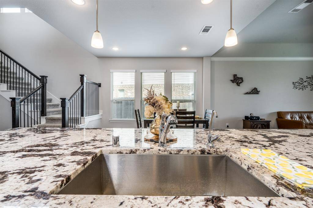 Up-close view of the beautiful granite. The kitchen opens to the breakfast/dining room and family room.