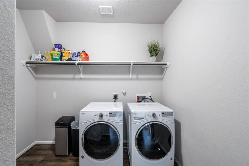 The utility room has room for your washer and dryer and a shelf for hanging your clothes.