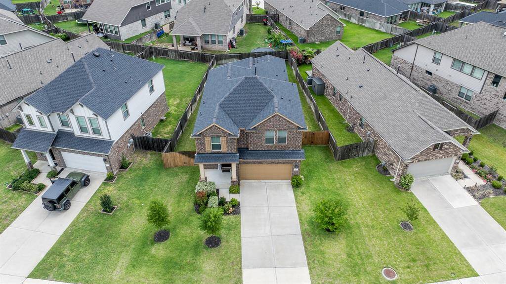 Enjoy this aerial view that shows off this property. The home also has full sprinkler system and gutters.