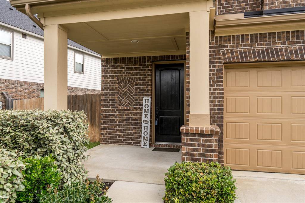 Take the sidewalk to the covered front porch of this home! Imagine spending your evenings with a cool drink in hand enjoying the great outdoors!