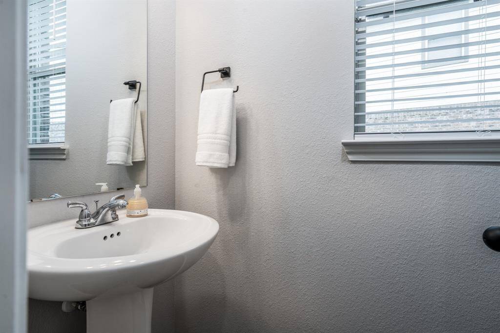 A quaint powder bath offers your guests a place to freshen up during a visit!