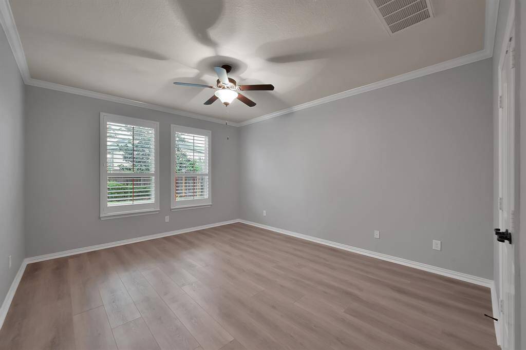 Spacious Primary Suite with Plantation Shutters.