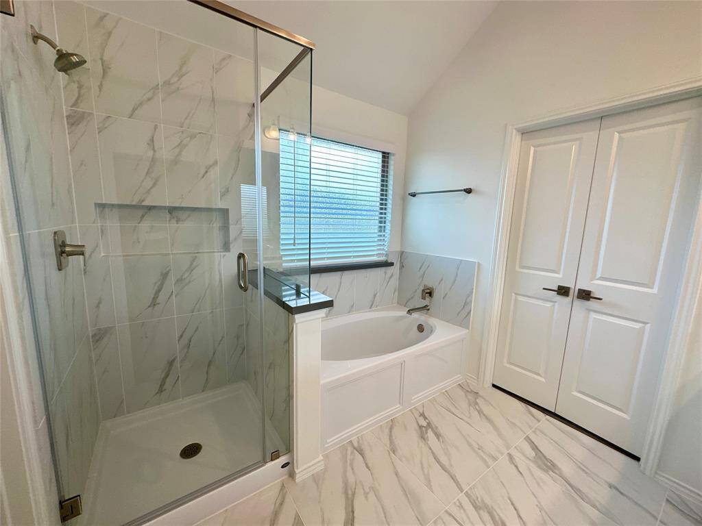 Spacious walk-in shower and tub.
