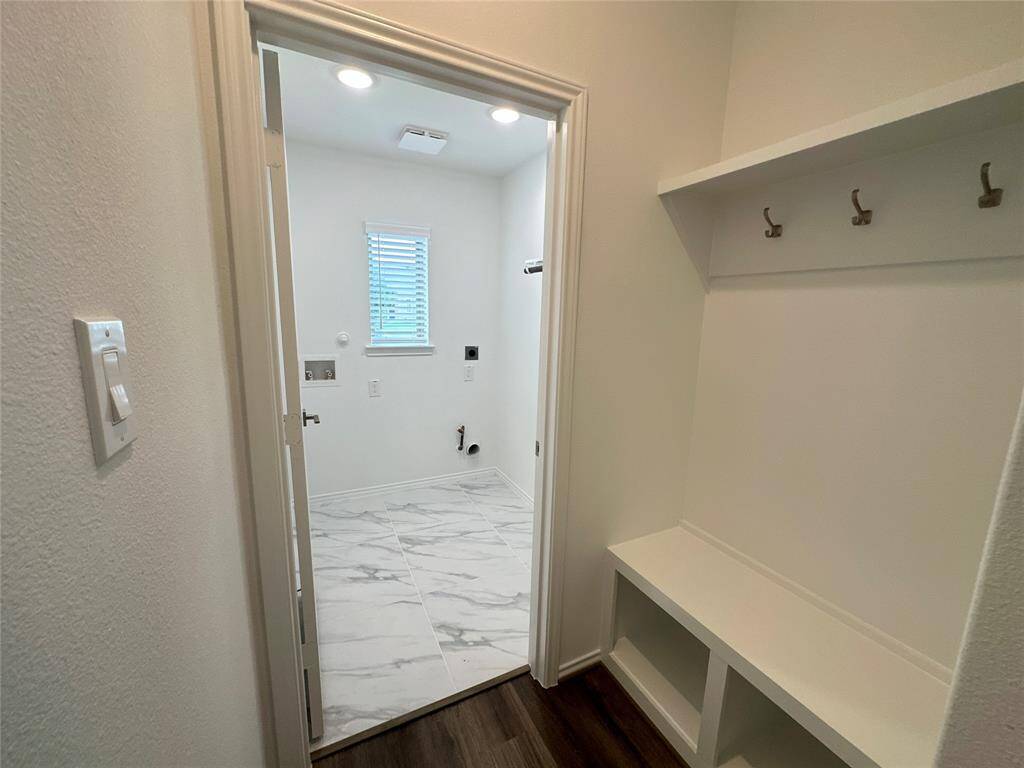 Mud room and a spacious laundry room.