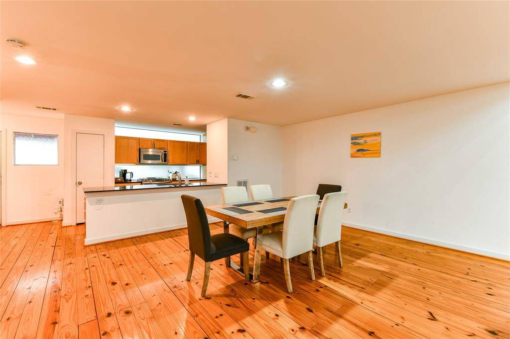 Open concept 2nd floor with living room, dining space, and kitchen.