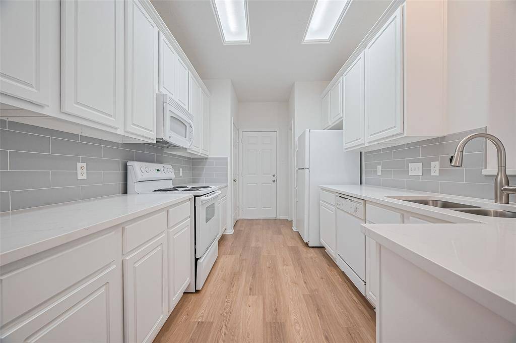 Spacious kitchen with included refrigerator.