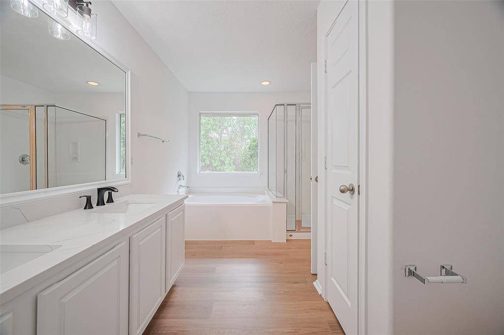 Spacious primary bath with elegant double sinks for added convenience.