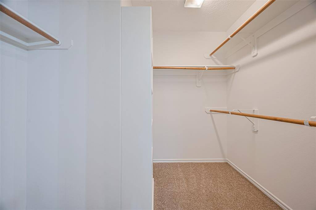 Spacious walk-in closet with ample storage.