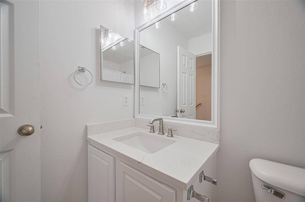 Conveniently located half bath on the main floor, perfect for guests.