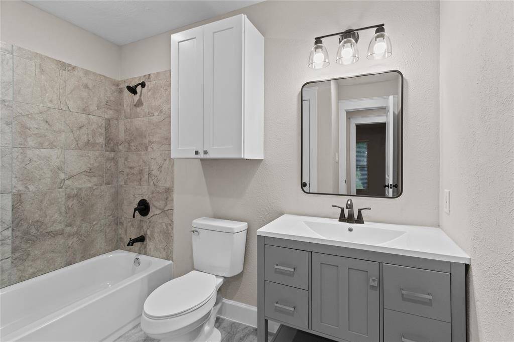 Secondary restroom; tub/shower combo.
