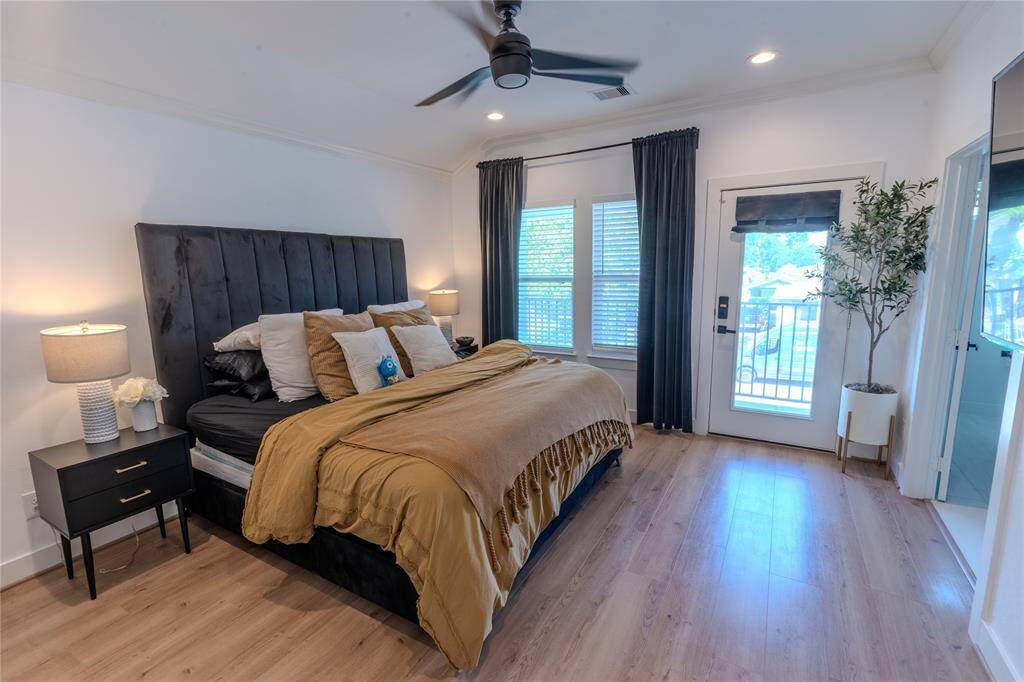 Primary bedroom with private ensuite and balcony that overlooks front of home.