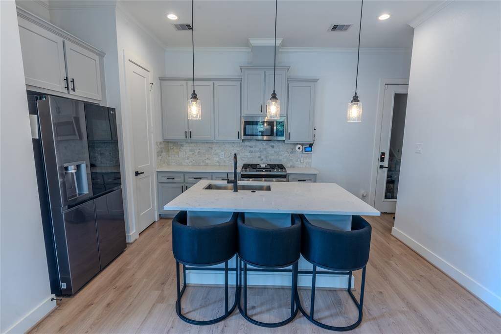 Door in the right corner leads to the attached 2-car garage.