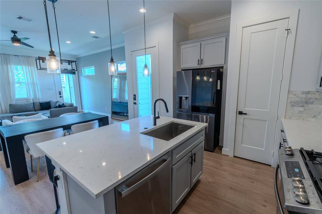 Kitchen, dining, and living area offer plenty of entertainment space for friends and family!