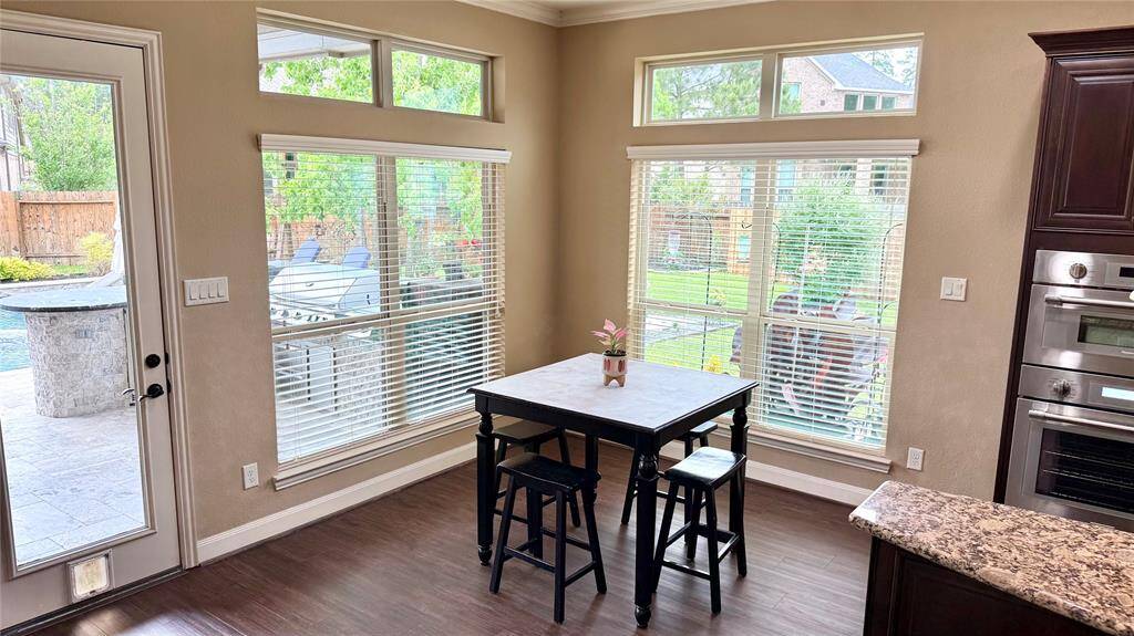 Breakfast nook with an outstanding view of the backyard oasis