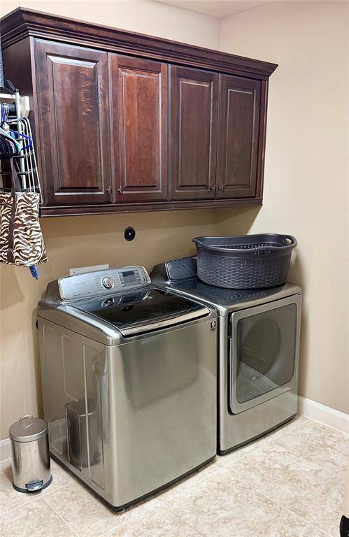 Laundry room located in the house with a built in dryer rack and room for a fridge!