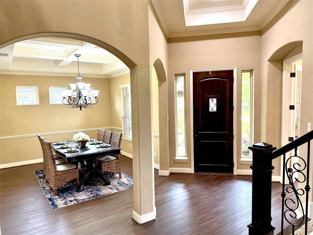 Front view of home interior looking toward the front door.