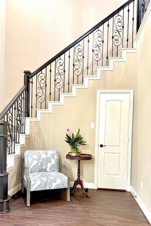 Cute entryway just inside the front door with a roomy coat closet