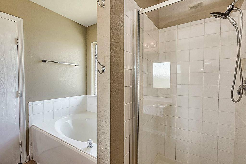 Separate shower and tub in the Primary Bathroom