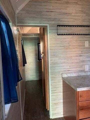 Hallway leads to bedroom