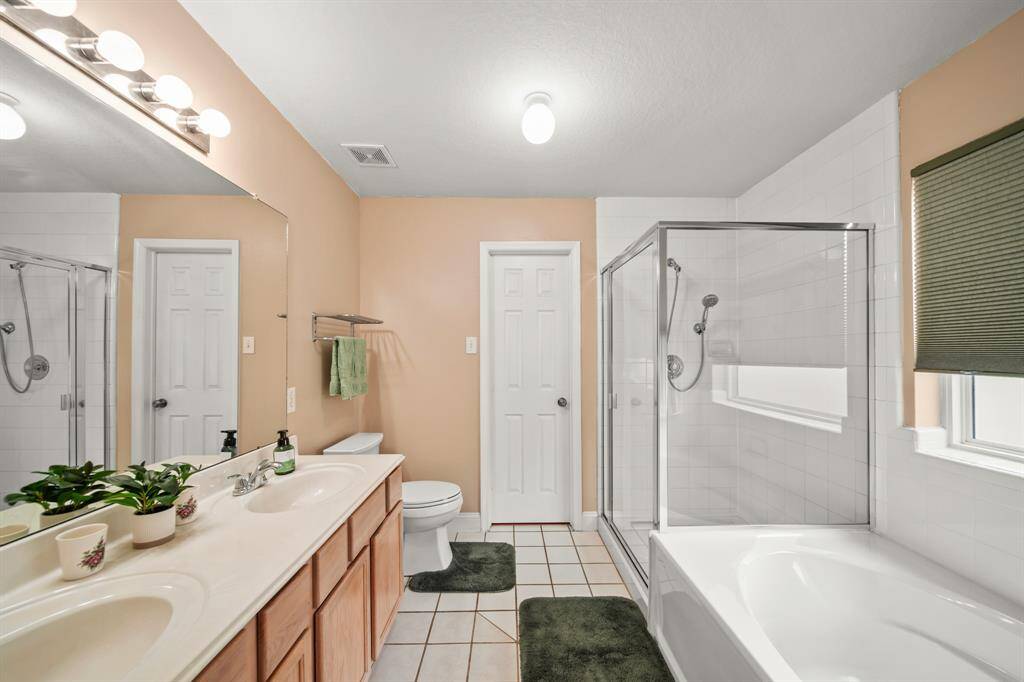 Bright and airy bathroom featuring ample natural light and modern fixtures for a fresh, inviting feel.