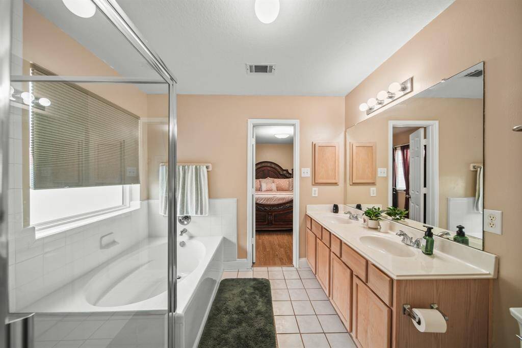 Bright and airy bathroom featuring ample natural light and modern fixtures for a fresh, inviting feel.