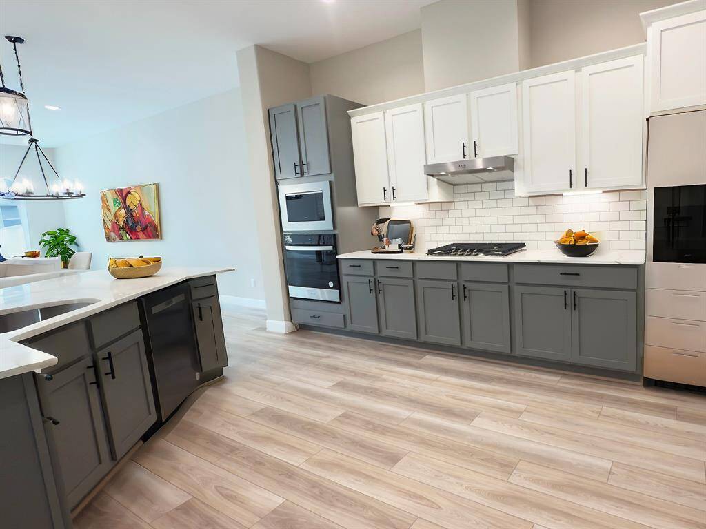 Welcome to the heart of the home - a culinary paradise where design and functionality meld seamlessly to create the ultimate kitchen experience. *Image depicts home as-is virtually staged.