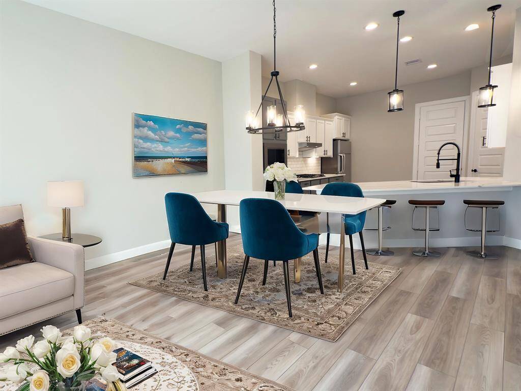 Discover an oasis of refined elegance in this stunning dining area, where every meal turns into a luxurious banquet. *Image depicts home as-is virtually staged.