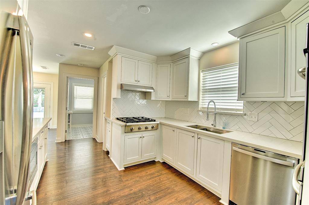 Beautiful spacious kitchen, with updated appliances. The Refrigerator washer and dryer all can be purchased with the sale of the home.