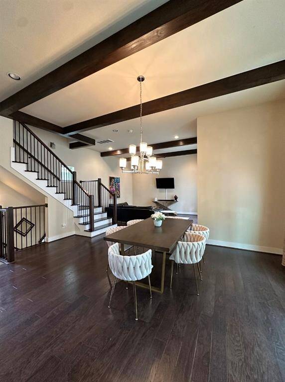 Open concept floor plan with hard wood floors throughout the 2nd floor and all stairs. Coming up to the 2nd floor you have a half bath at the landing and then open up to the gourmet kitchen and dining room.