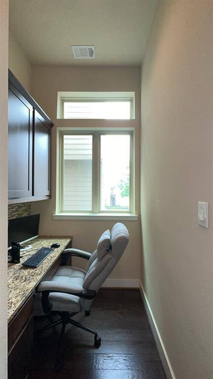 Study nook right off the kitchen. This could be used as an office space or even a bar area. Plenty of cabinet space for more storage.