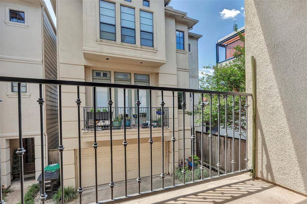 Cozy balcony view overlooking a neighboring townhomes. Balcony located off of the living room.