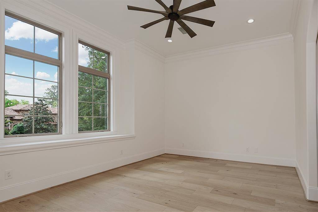 This guest bedroom upstairs has a built-in vanity, enormous walk-in closet and amazing remodeled bath - fit for the princess in your life!